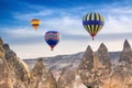 Three bright multi-colored hot air balloons flying in sky Royalty Free Stock Photo