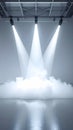 Three Bright Stage Lights Illuminating White Smoke in a Dark Industrial Studio Royalty Free Stock Photo