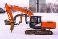 Excavators on a winter building site