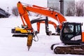 Excavators on a winter building site