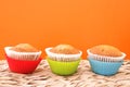 Three bright vanilla muffins