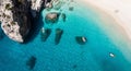 Bright yellow kayaks floating in the tranquil, clear blue waters of a secluded bay