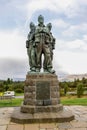 Three British commandos of the Commando Memorial looking towards Ben Nevis mountain near Spean Bridge village in Scottish Highland Royalty Free Stock Photo