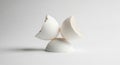 Three broken eggshell pieces arranged in a geometric, artistic stack. The Royalty Free Stock Photo