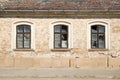 Three broken windows in a wall of a damaged building Royalty Free Stock Photo