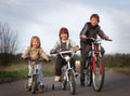 Three brothers ride bikes