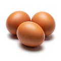 Three brown chicken eggs grouped together isolated on a clean white surface Royalty Free Stock Photo