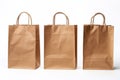 Three brown craft shopping bags. Empty mockup on a white background. Generative AI