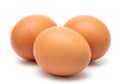 Three brown eggs on a white background Royalty Free Stock Photo