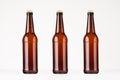 Three brown longneck beer bottles mock up. Royalty Free Stock Photo