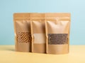 Three brown paper bags of seeds isolated on white background Royalty Free Stock Photo