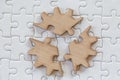 Three brown pieces of puzzle on a white jigsaw background, last piece of jigsaw puzzle to complete the mission, Business solutions