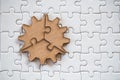 Three brown pieces of puzzle on a white jigsaw background, last piece of jigsaw puzzle to complete the mission, Business solutions Royalty Free Stock Photo