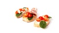 Three bruschetta on a ciabatta on a white plate. Italian appetizer Royalty Free Stock Photo