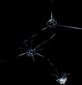 Three bullet hole in glass close up on black background Royalty Free Stock Photo