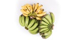 Three bunches organic green and yellow banana on white background