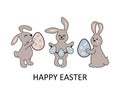Three bunnies, rabbits with eggs on white background Royalty Free Stock Photo