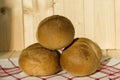 Three buns of wheat flour for a breakfast. Belgian bread. Closeup Royalty Free Stock Photo