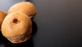 Three buns on a wooden table closeup Royalty Free Stock Photo