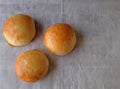 Three Burger Buns on Wood (Top View) Royalty Free Stock Photo