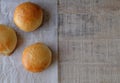 Three Burger Buns on Wood (Top View) Royalty Free Stock Photo