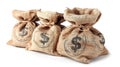 Three burlap money bags with black dollar signs, on white background. Royalty Free Stock Photo