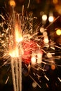 Three burning christmas sparklers. Royalty Free Stock Photo