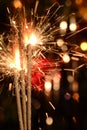 Three burning christmas sparklers. Royalty Free Stock Photo