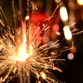 Three burning christmas sparklers. Royalty Free Stock Photo