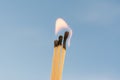Three burning matches on a blue background Royalty Free Stock Photo