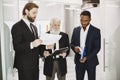 Three busines partners men in the office Royalty Free Stock Photo