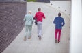 Three business men running trough street Royalty Free Stock Photo