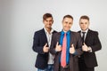 Three business men in suits standing like a team Royalty Free Stock Photo