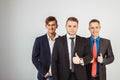 Three business men in suits standing like a team Royalty Free Stock Photo