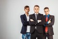 Three business men in suits standing like a team Royalty Free Stock Photo