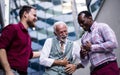 Three business men talking. They laugh Royalty Free Stock Photo