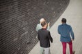 Three business men talking and walking.  Above view.   Going to work Royalty Free Stock Photo