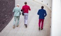 Three business men talking and walking. Running to work.   Above view Royalty Free Stock Photo