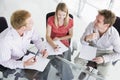 Three business people in a boardroom