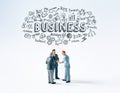 Three business people figurines making a deal or talking about a project while hand drawn conceptual doodles above them Royalty Free Stock Photo