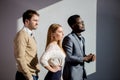 Three business people keeping arms crossed and looking away Royalty Free Stock Photo