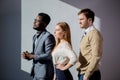 Three business people keeping arms crossed and looking away Royalty Free Stock Photo