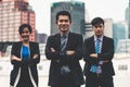 Three business people standing with arms crossed. Royalty Free Stock Photo