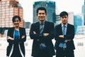 Three business people standing with arms crossed. uds Royalty Free Stock Photo