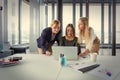 Three business women in modern office working on the project together Royalty Free Stock Photo