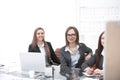 Three business women sitting at Desk in office.photo with copy space Royalty Free Stock Photo