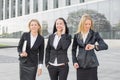 Three business women using technology gadgets Royalty Free Stock Photo