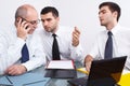 Three businessman sitting at table during meeting Royalty Free Stock Photo