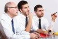 Three businessman sitting at table during meeting Royalty Free Stock Photo