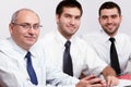 Three businessman sitting at table during meeting Royalty Free Stock Photo